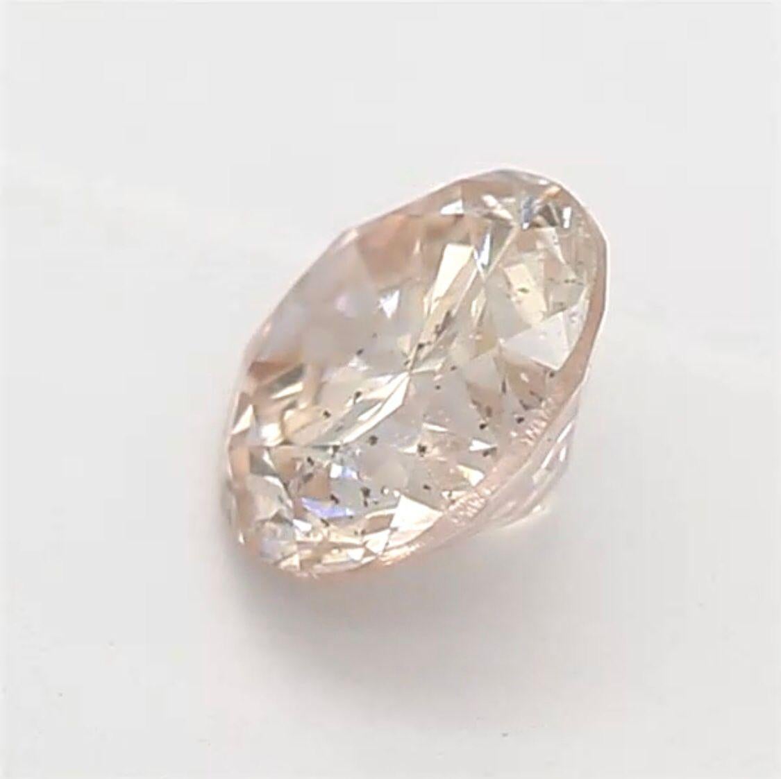 Women's or Men's 0.28 Carat Light Orangy Pink Round Shaped Diamond SI2 Clarity CGL Certified For Sale