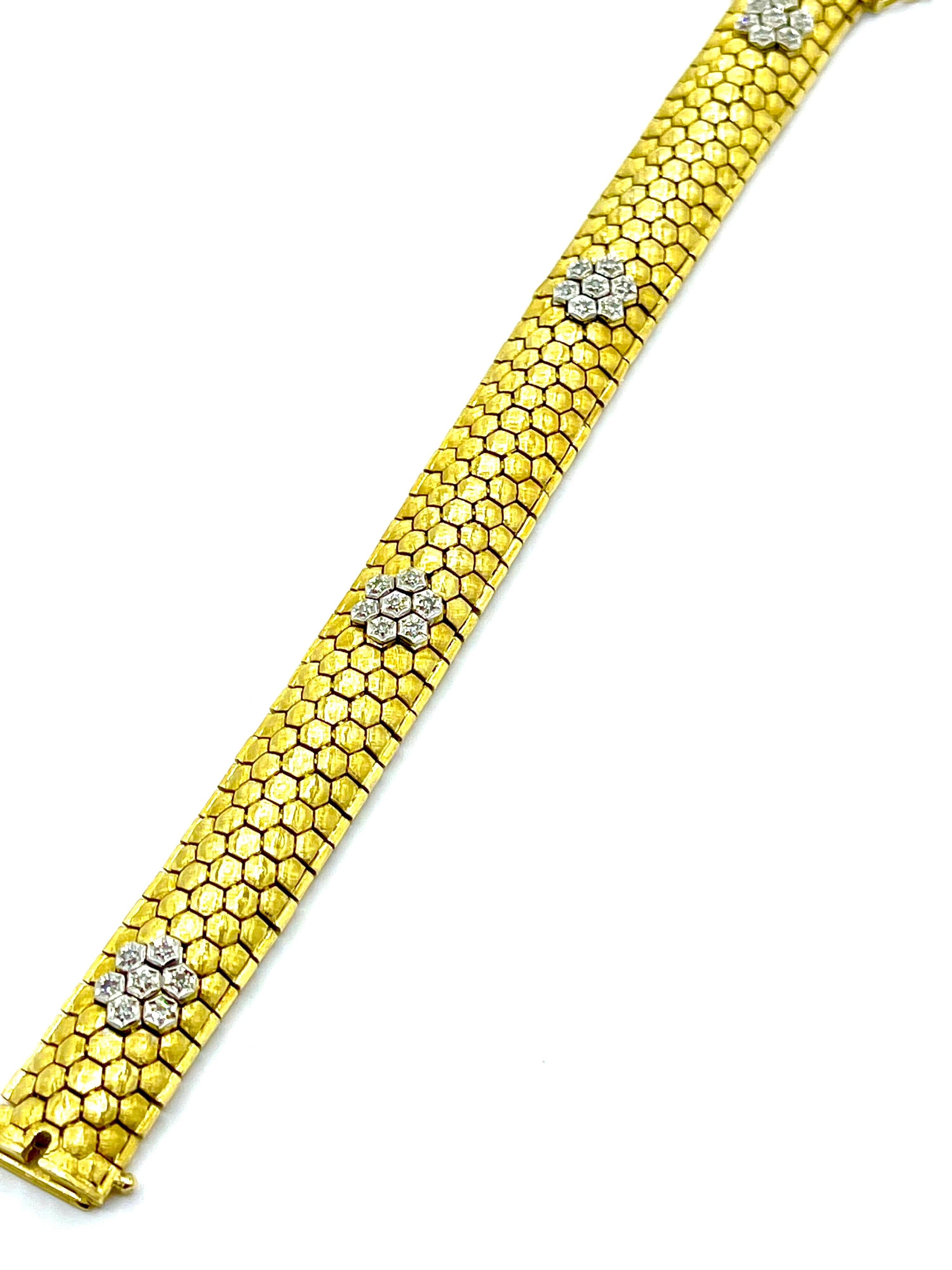 A simple and elegant bracelet in 18K yellow and white gold.  The bracelet has four Diamond stations set in white gold containing 0.28 carats in round brilliant Diamonds.  The links of the bracelet are handcrafted in honeycomb form with a brushed