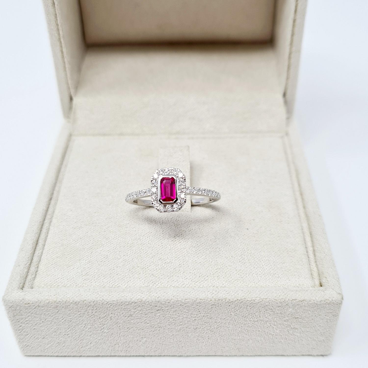 Beautiful modern engagement ring. New ring with tags. The ring consists of white gold with 0.28 Ct ruby and 0.31 Ct diamonds round cut.
Total weight: 2.56 grams
Metal: white gold 18Kt
New contemporary jewelry. 
US Ring size 7 please see the