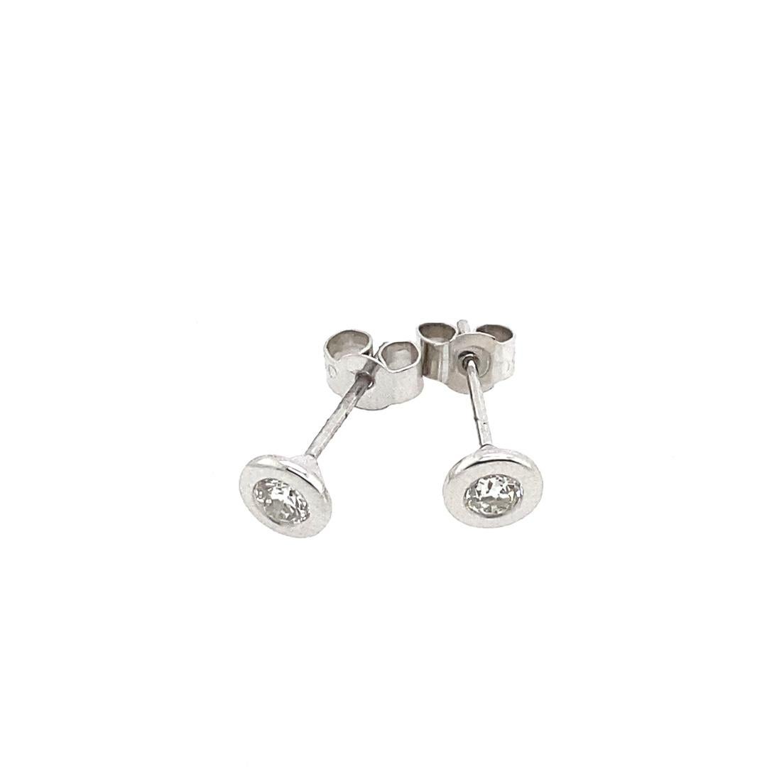New 18ct White Gold Diamond Studs Earrings, In Rubover Setting, 0.28ct of Diamonds

In Rubover Setting With Peg and Screw

Additional Information:
Total Diamond Weight: 0.28ct
Diamond Colour: G/H
Diamond Clarity: SI
Total Weight: 1.2g  
SMS4081