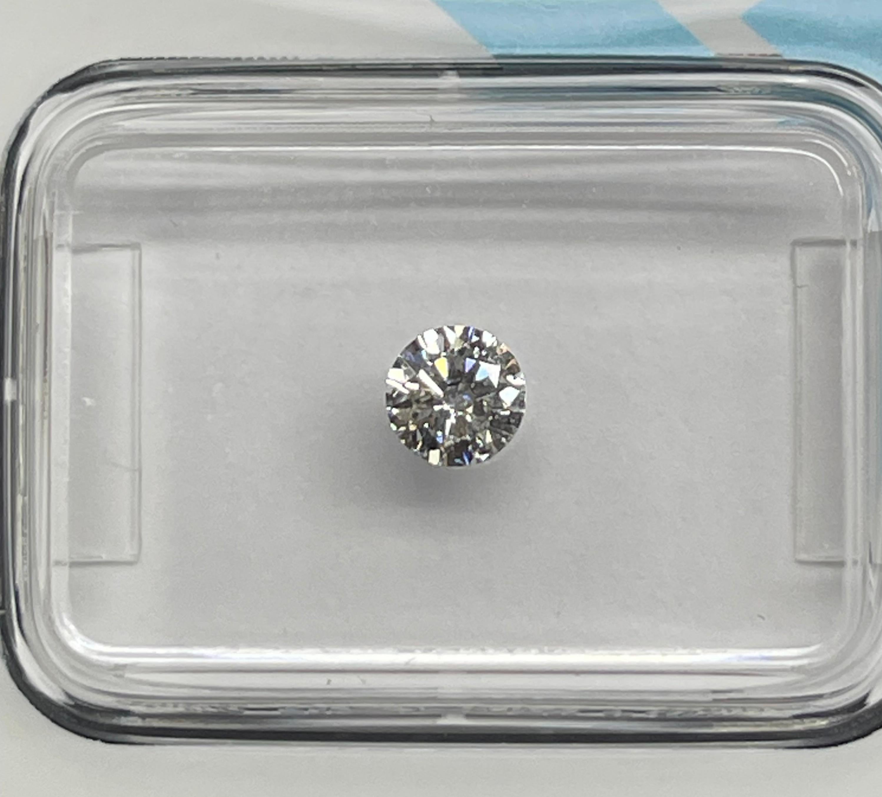 Natural Diamond graded by IGI.

Shape: Round Brilliant
Weight: 0.28 CT
Color: D
Clarity: VS2
Cut: Excellent
Polish: Excellent
Symmetry: Excellent
Fluorescence: Very Slight
Laser inscription : IGI 630434196