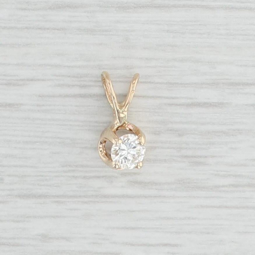 Gemstone Information:
- Natural Diamond -
Carats - 0.28ct
Cut - Round Brilliant
Color - H
Clarity - VS2

Metal: 14k Yellow Gold
Weight: 0.7 Grams 
Stamps: 14k
Measurements: 11.8 x 5.8 mm (including bail)
The bail will accommodate up to a 2.8 mm