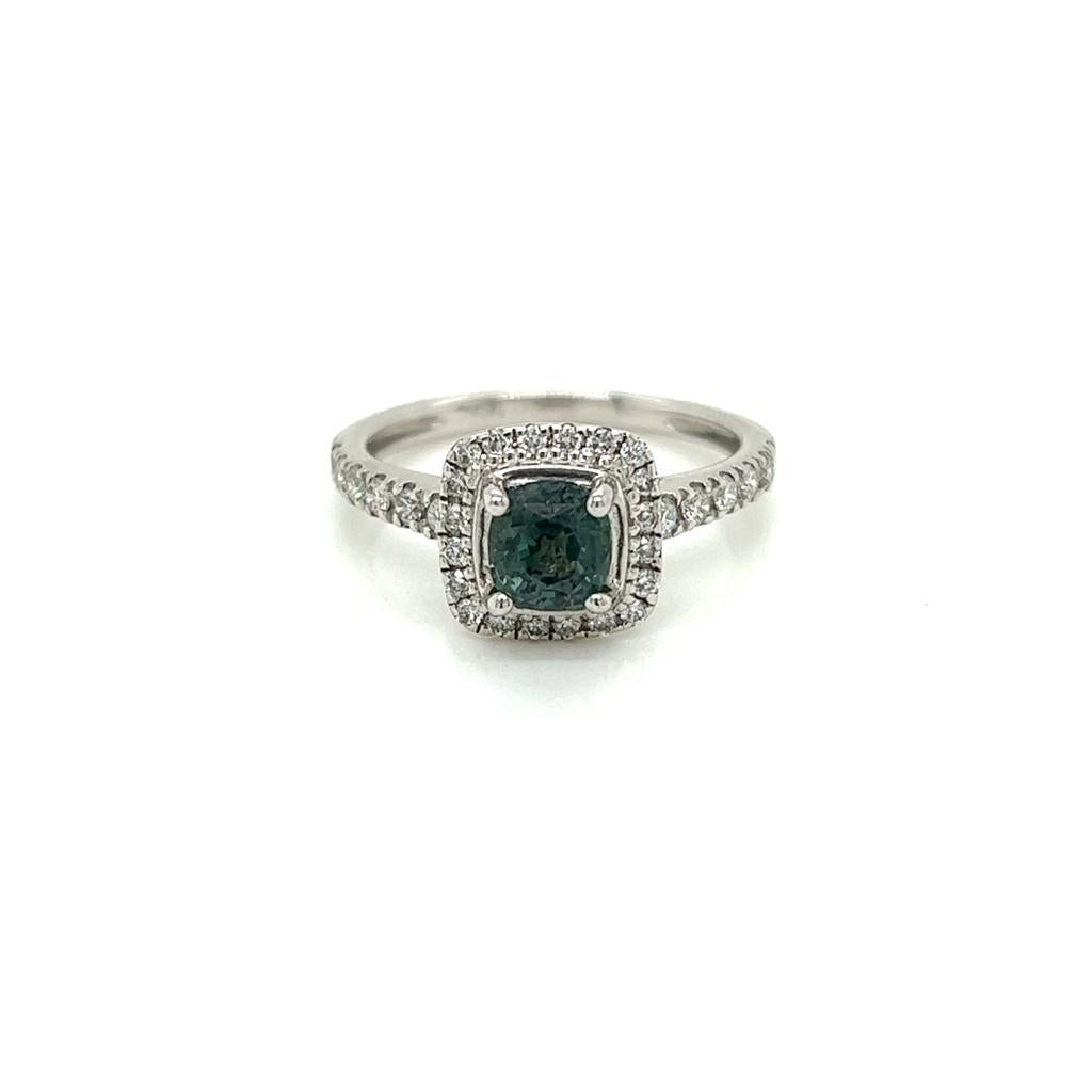 0.29 Carat Cushion cut Alexandrite and Diamond Ring in 18 Karat White Gold.

This gorgeous ring features a 0.29 carat cushion cut alexandrite at its centre, surrounded by a halo of round brilliant diamonds on an 18K White Gold band. The diamonds