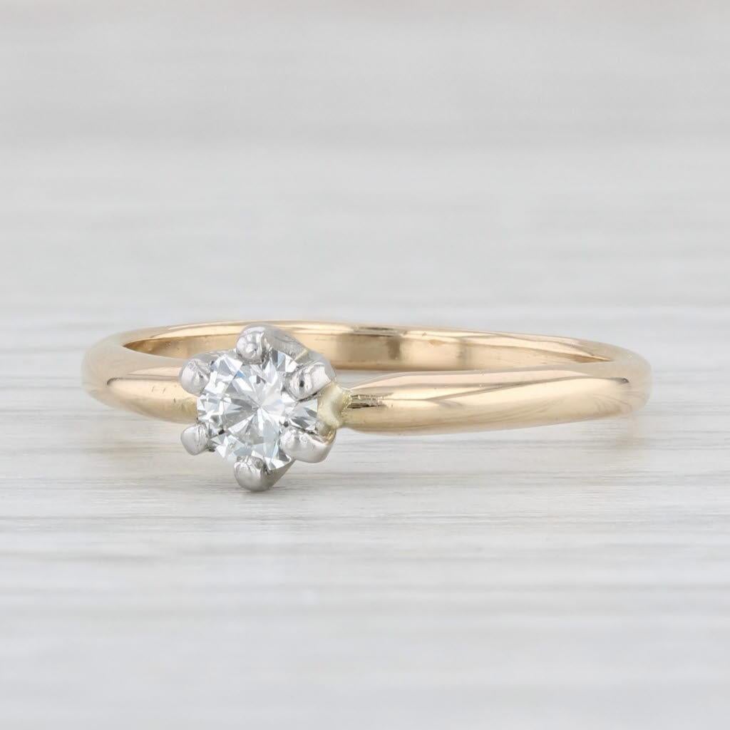 Gemstone Information:
- Natural Diamond -
Carats - 0.29ct 
Cut - Round Brilliant
Color - F - G
Clarity - VS2

Metal: 14k Yellow Gold Band, White Gold Prongs 
Weight: 2.7 Grams 
Stamps: 14k
Face Height: 5.7 mm 
Rise Above Finger: 5.5 mm
Band / Shank