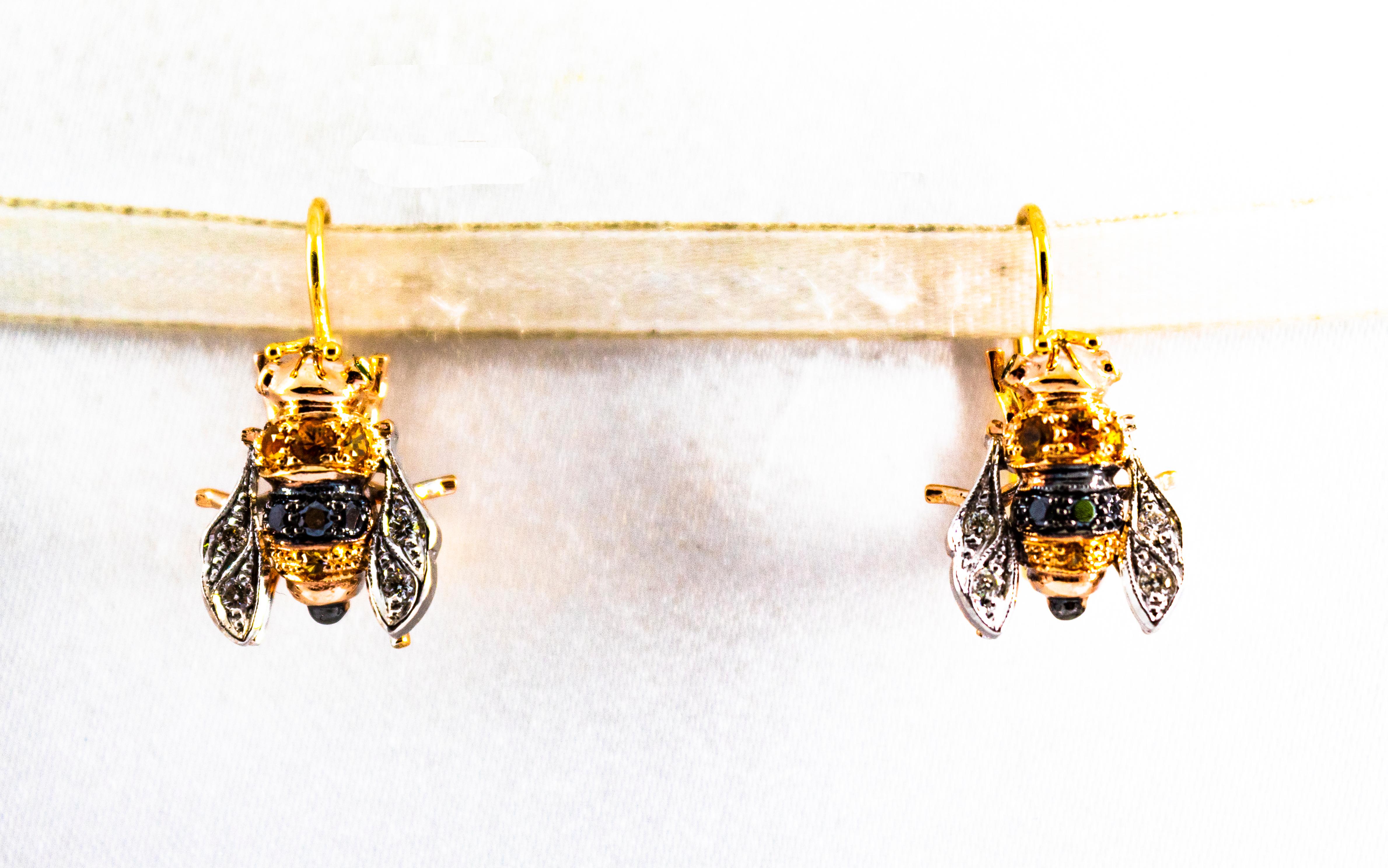 These Earrings are made of 9K Yellow Gold and Sterling Silver.
These Earrings have 0.16 Carats of White Brilliant Cut Diamonds.
These Earrings have 0.14 Carats of Black Diamonds.
These Earrings have 0.35 Carats of Yellow Sapphires.

All our Earrings