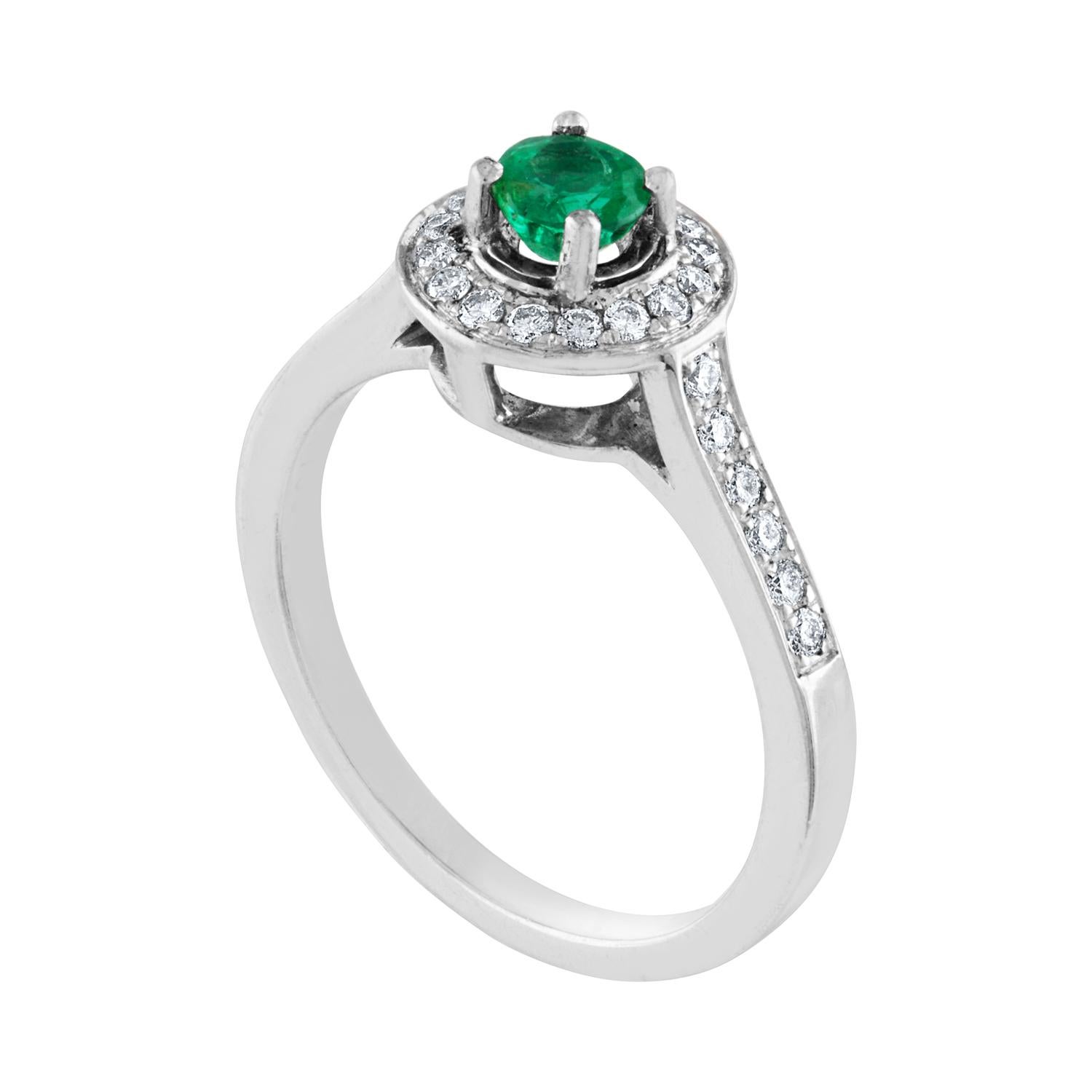Stunningly Simple Emerald Ring
The ring is 18K White Gold.
The Emerald is a round 0.30 Carat Natural Emerald
There are 0.25 Carats in Diamonds F/G VS/SI
The ring is a size 6.5, sizable.
The ring weighs 3.7 grams