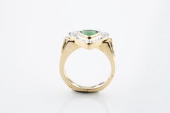 0.30 Carat Green Tourmaline Solitaire Ring with Diamond Accents in Yellow Gold