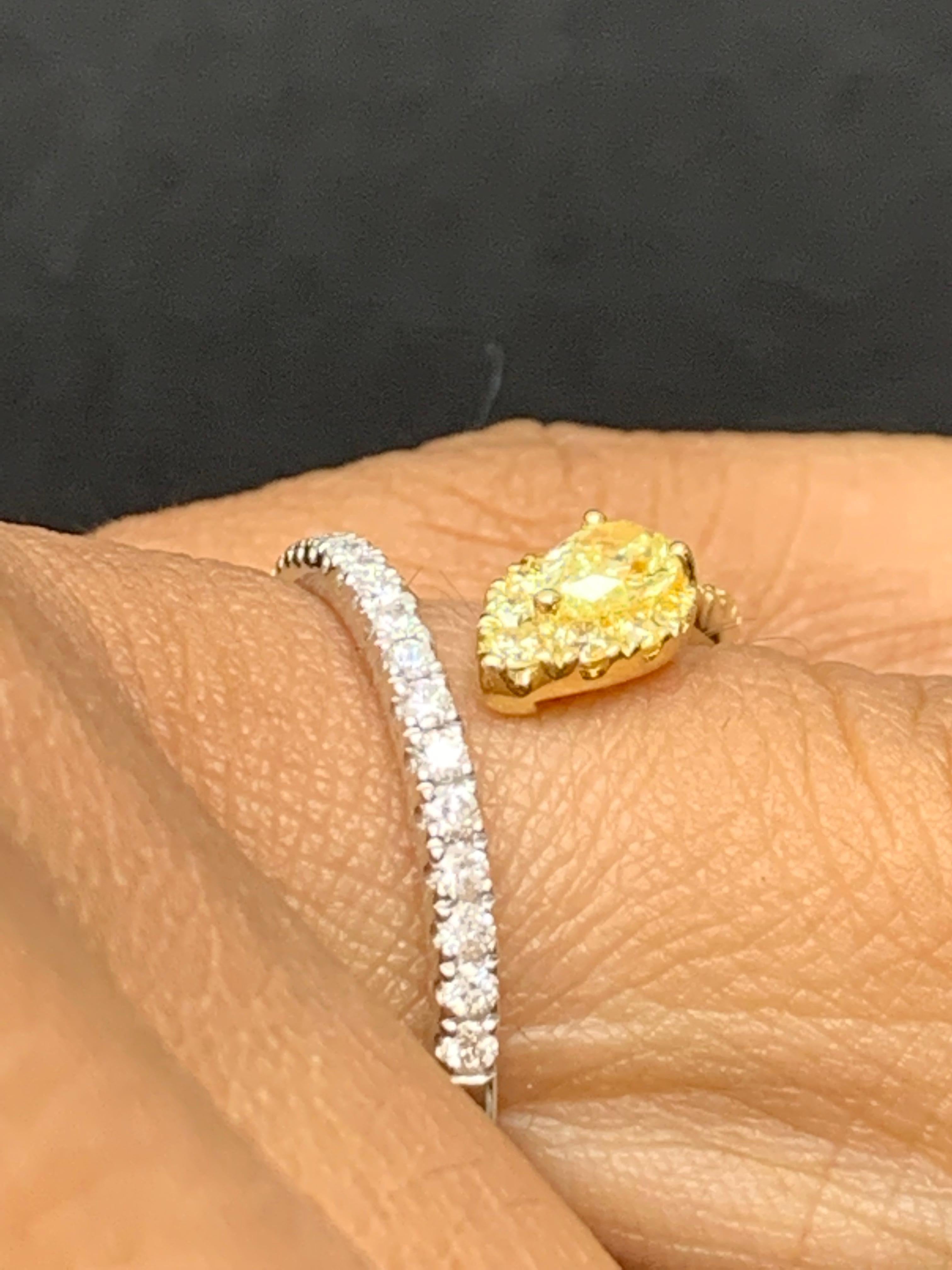 A fashionable piece of jewelry showcasing 0.30 carat of yellow diamond and 2 rows of brilliant cut white and yellow diamonds.  21 white diamonds weigh 0.21 carats and 17 yellow diamonds weigh 0.17 carats in total.

Size 6.5 US (Sizable). One of a