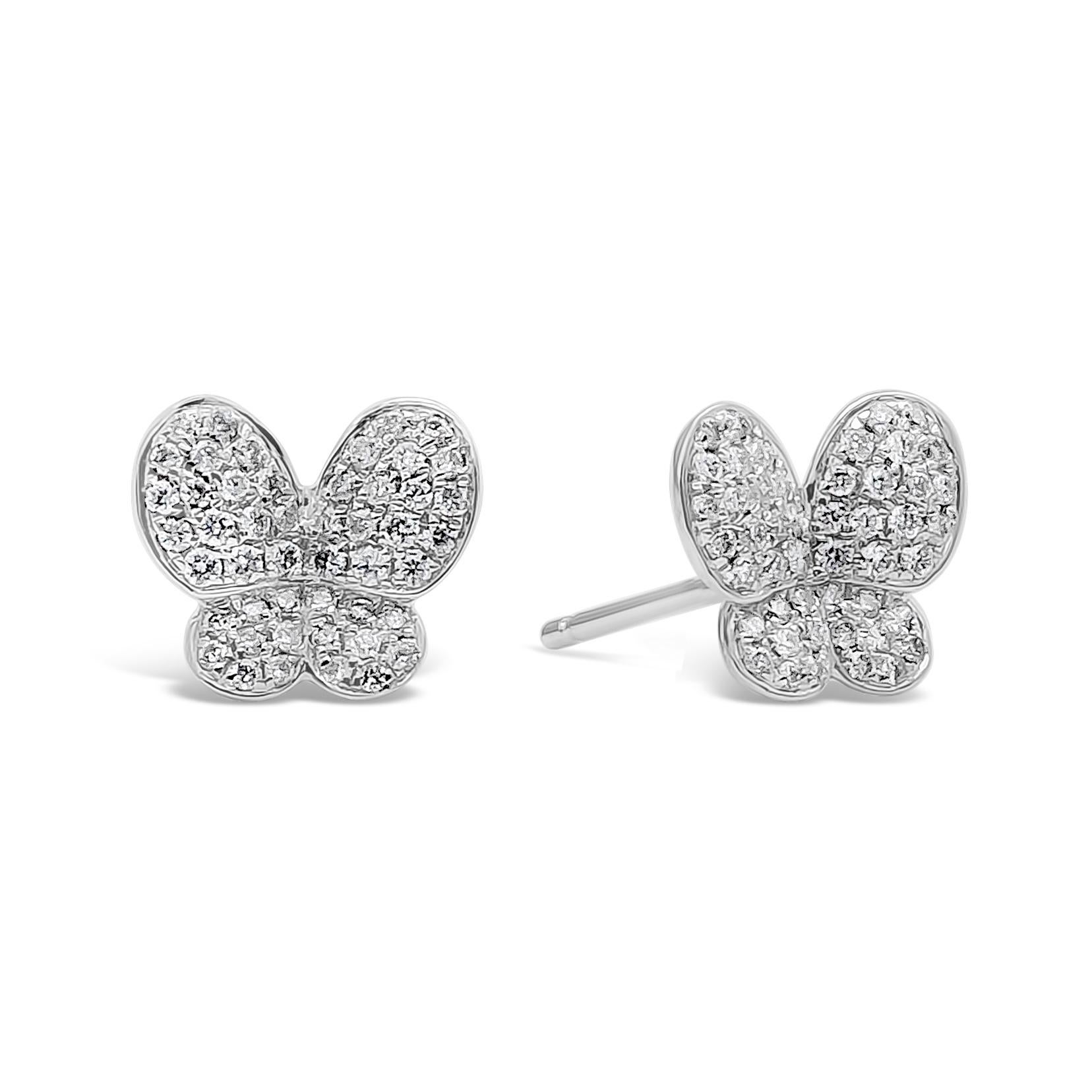 A unique and simple pair of stud earrings featuring a cluster of 96 brilliant round diamonds, micro-pave set in a butterfly motif setting made in 18k white gold. Diamonds weigh 0.30 carats total, F Color, VS-SI in Clarity. A perfect everyday piece