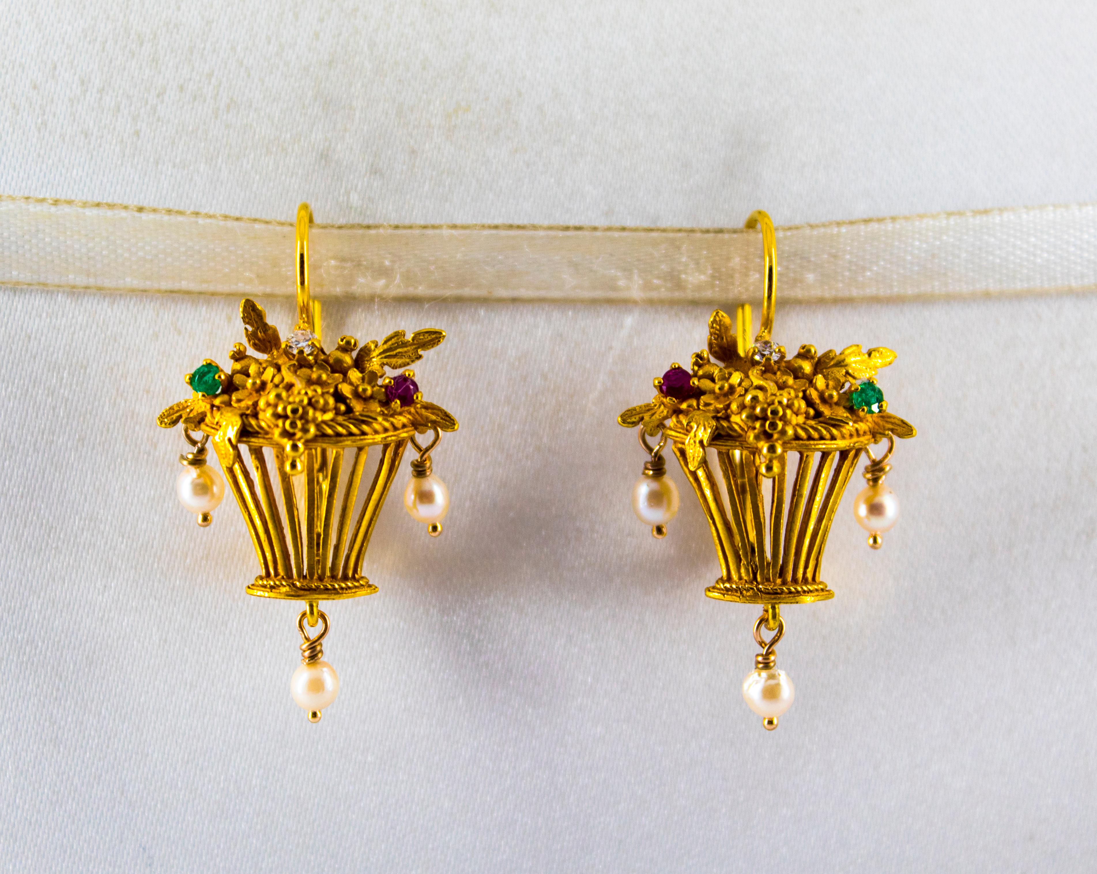 These Earrings are made of 14K Yellow Gold.
These Earrings have 0.10 Carats of White Diamonds.
These Earrings have 0.08 Carats of Emeralds.
These Earrings have 0.12 Carats of Rubies.
These Earrings have also Pearls.
All our Earrings have pins for