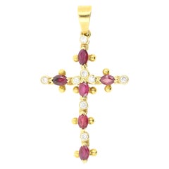 0.30 Ct Oval Rubies and 0.12 Ct Round Brilliant on a Suggestive 18k Gold Cross