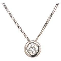 Pendentif solitaire en or blanc 9ct et 18ct de 0,30ct de diamant