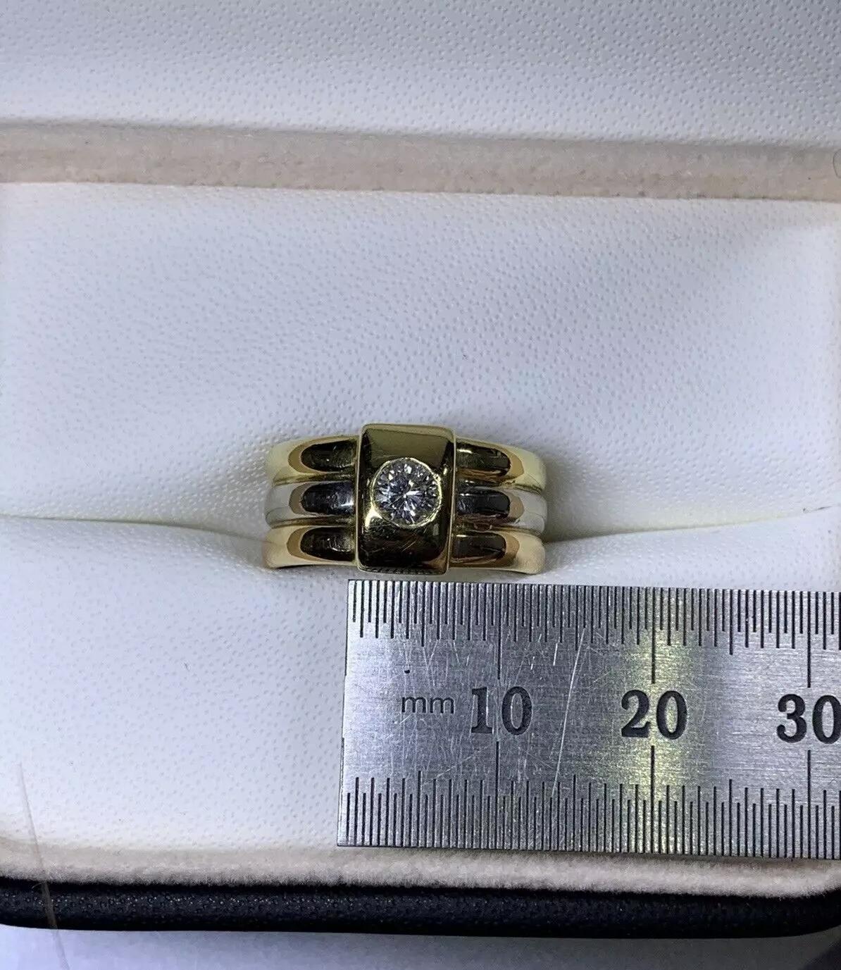 This exquisite 0.30ct Diamond Solitaire Russian Style Tricolour Chunky Engagement Ring is a true masterpiece. The timeless design is perfect for any occasion and will add a touch of elegance to any outfit. Crafted from 18ct Yellow Gold, the ring