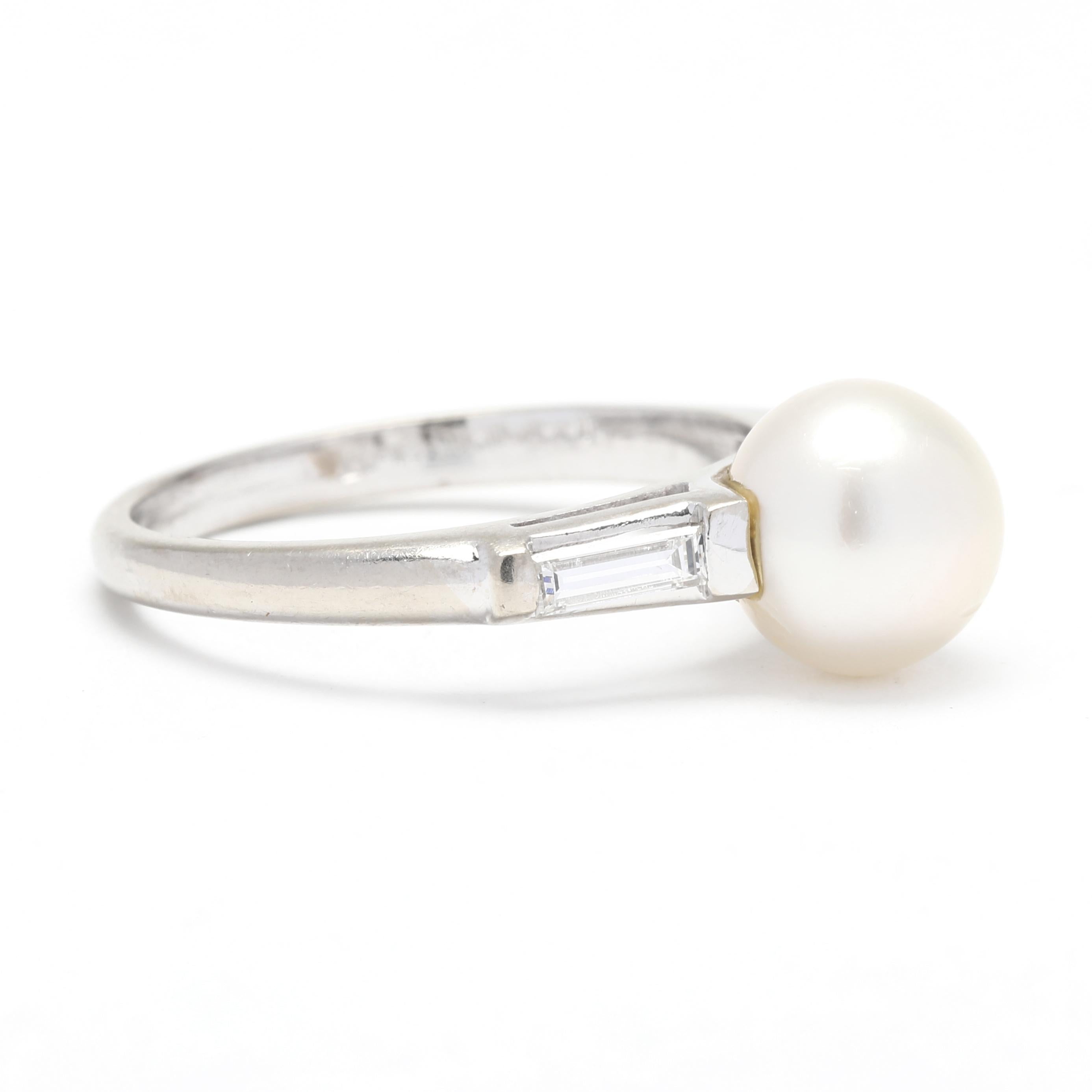 This elegant 0.30ctw pearl baguette diamond engagement ring is crafted in luxurious platinum. At the center of this solitaire ring lies a luminous pearl, surrounded by a shimmering baguette diamond halo. This beautiful pearl engagement ring is