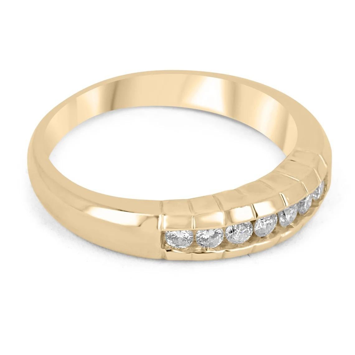 Displayed is a men's diamond wedding band in 14K yellow gold. Soft lines highlight the smooth edges of this ring and provide texture in its simple design. Seven, brilliant-cut diamonds are channel set in the center and are of excellent quality. The