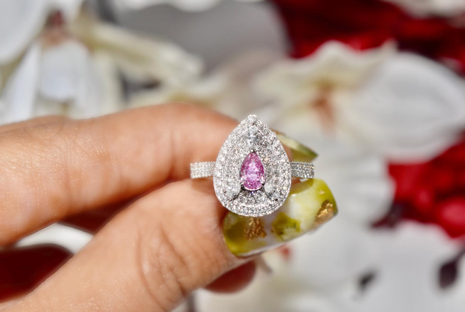 **100% NATURAL FANCY COLOUR DIAMOND JEWELRY**

✪ Jewelry Details ✪

♦ MAIN STONE DETAILS

➛ Stone Shape: Pear
➛ Stone Color: Faint Pink
➛ Stone Weight: 0.31 carat
➛ Clarity: SI2
➛ GIA certified

♦ SIDE STONE DETAILS

➛ Side pear shape diamonds - 2