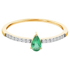 0.31 Carat Pear Cut Emerald and Diamond Engagement Ring