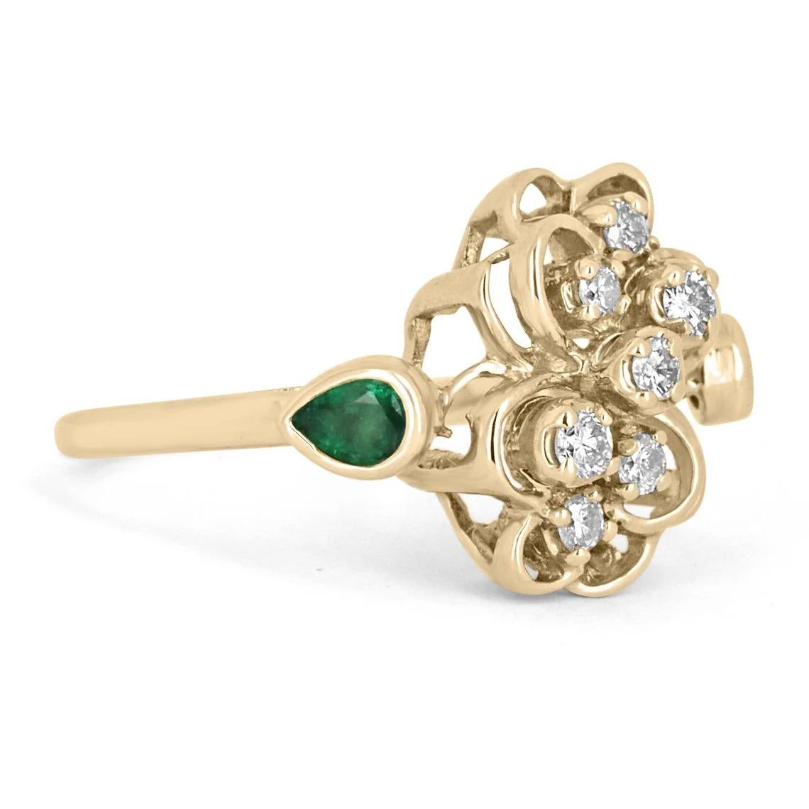 A AAA+ dark green Colombian emerald and diamond ring antique ring. Created in everlasting, 14k yellow gold the fine emerald has incredible color and ideal eye clarity. The gem is set in a secure bezel setting. This antique ring is fashionable and