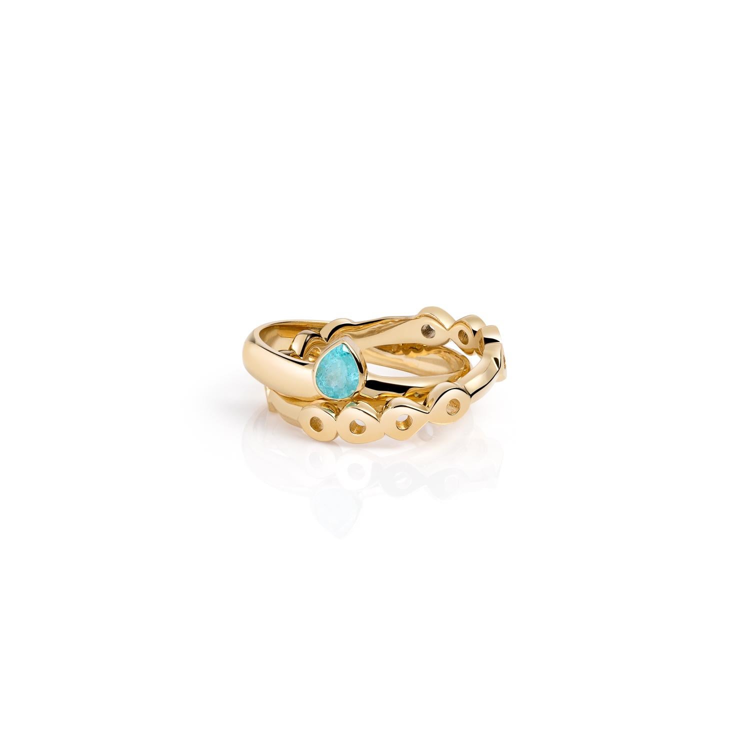 We linked a ring band with a stunning Paraiba Tourmaline Pear shape stone to a plain half-round band for added comfort.

These two rolling ring bands are comfortable, make a statement and work great as alternative wedding bands. Hi June Parker
