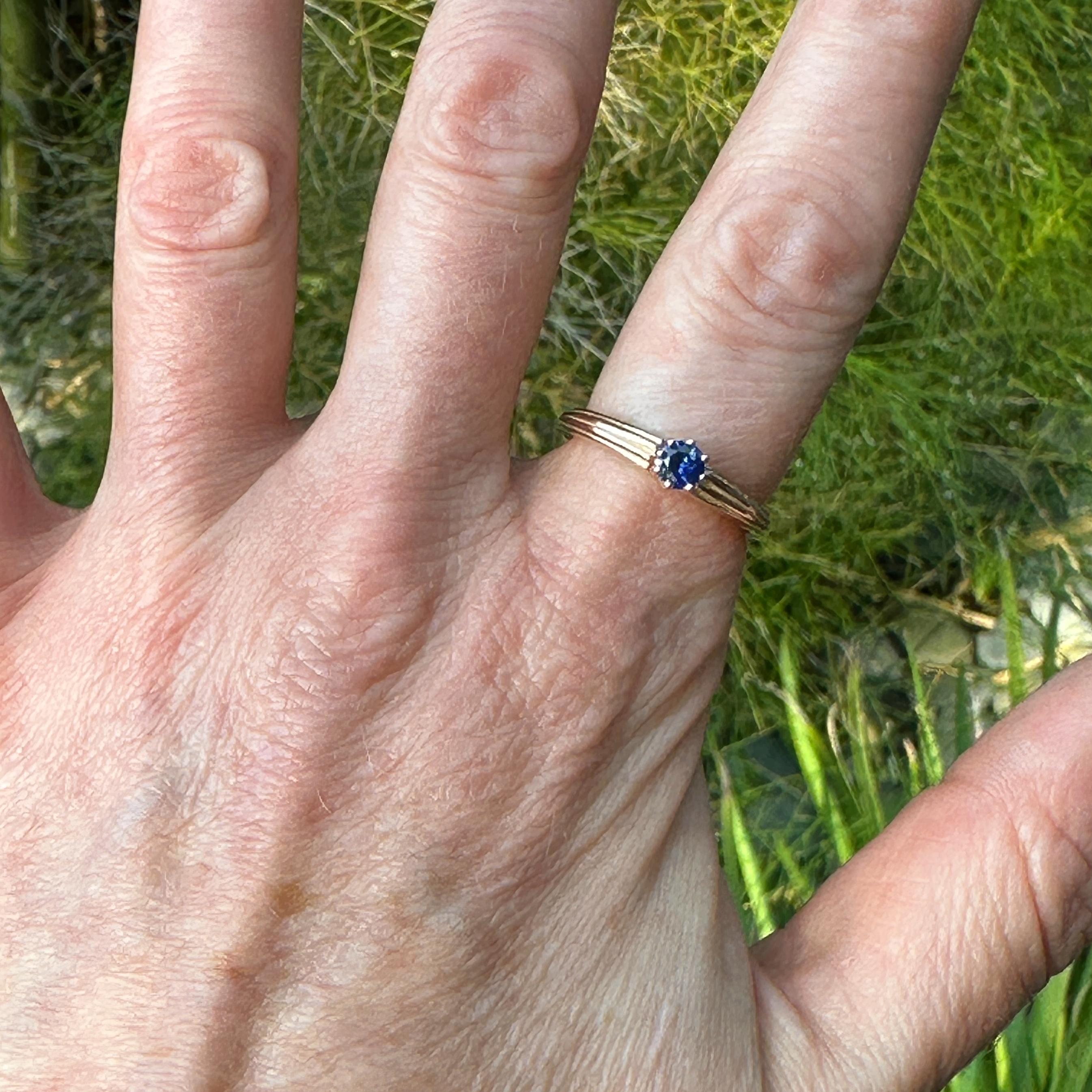 Eytan based the design of this ring on an old Czech engagement ring that came through the store years ago.  It's simple, nicely balanced and substantial.  The pleated front tapers to a smooth  polished half-round band.  

The eight-prong center