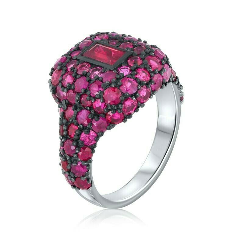 Mesmerizing baguette-shaped ruby and brilliant round rubies total weight 4.15 carat set in black gold.

