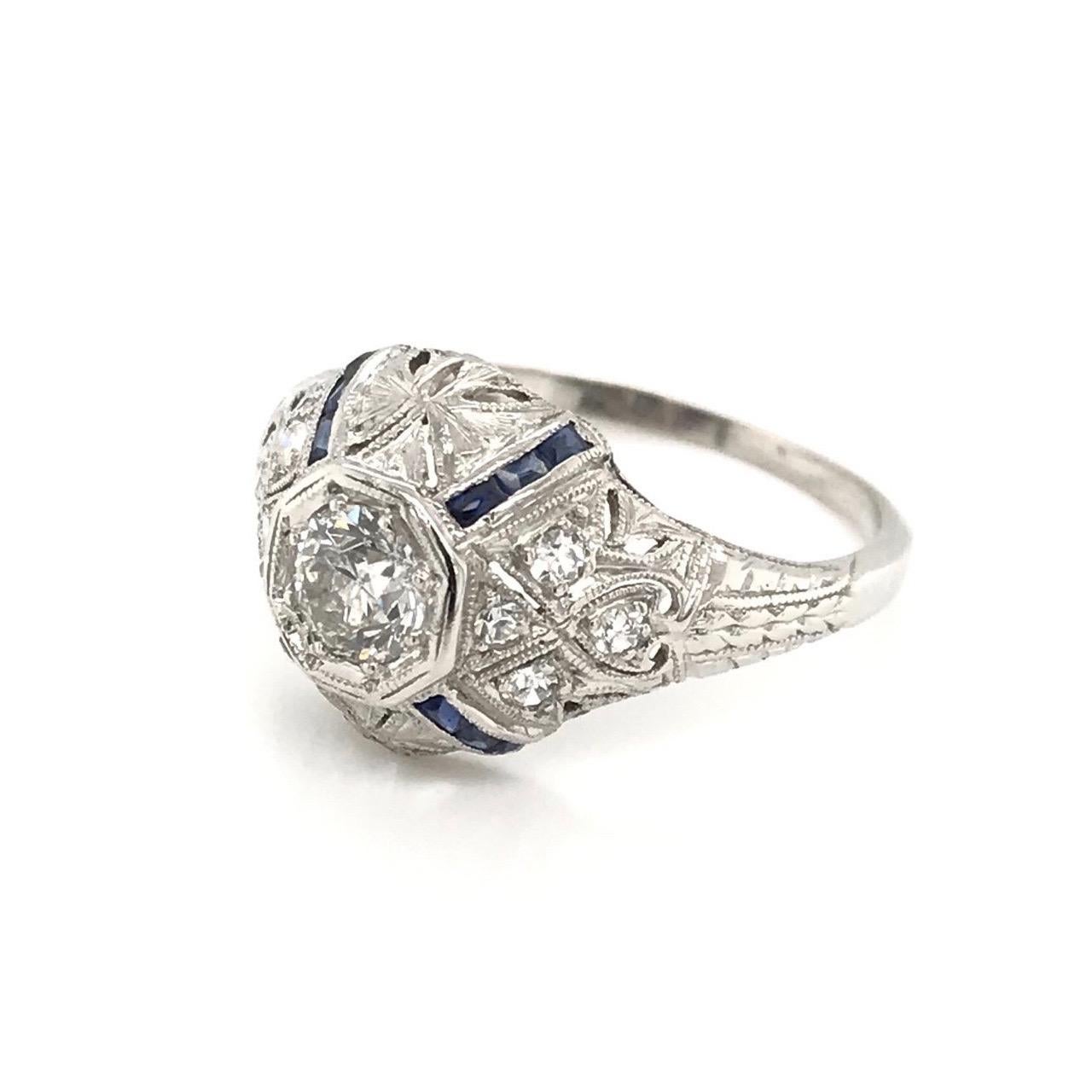This antique piece was handcrafted sometime during the Art Deco design period ( 1920-1940 ). This ring is quite the exquisite antique jewelry piece! The platinum setting features a 0.33 carat diamond in the center ( one third of one full carat ).