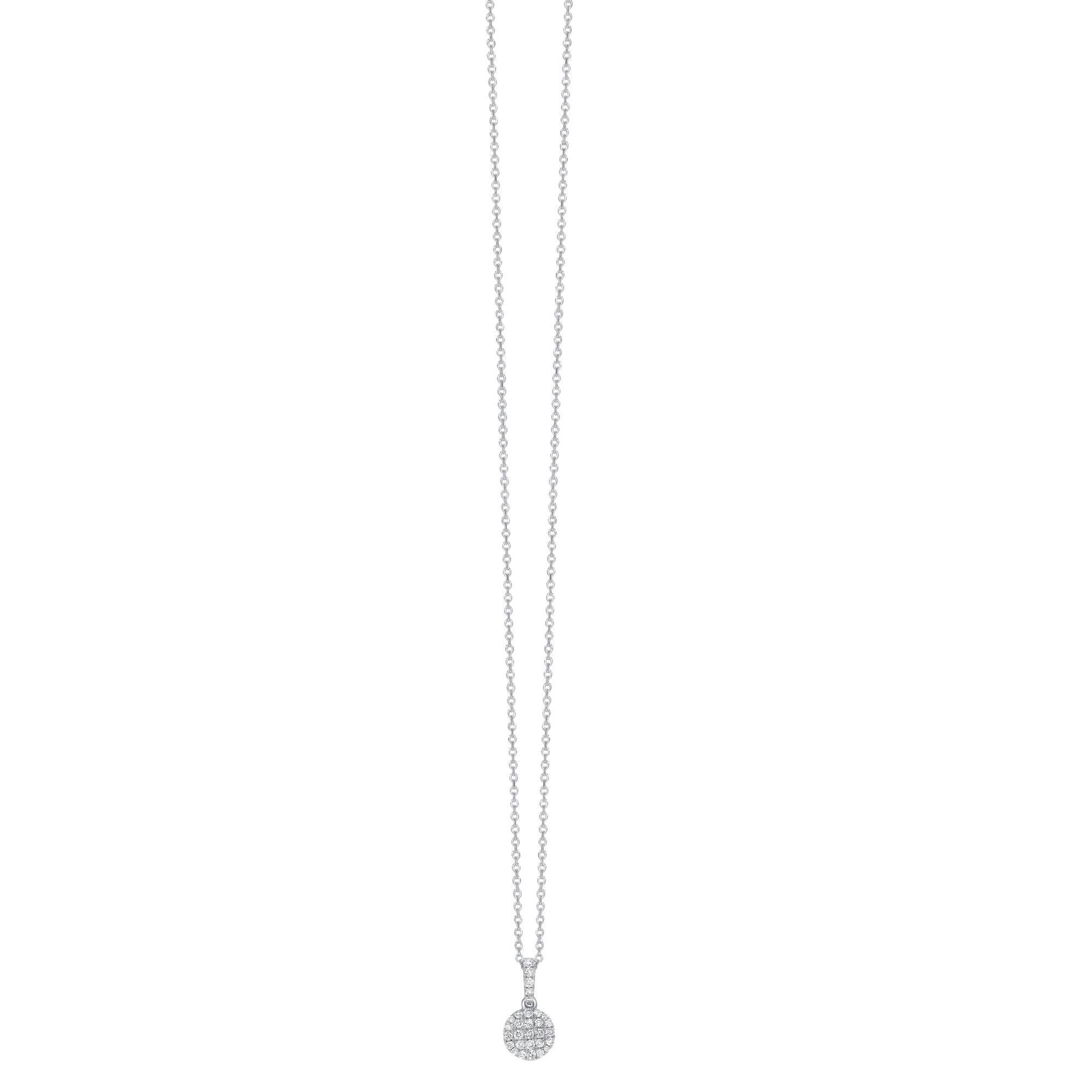 This delicate 7mm round brilliant Diamond button shaped pendant glistens with the Diamonds highlighted by the 18 Karat White Gold setting. H-SI white diamonds in a round cluster with a pave set on the chain connector. The total Diamond weight of the