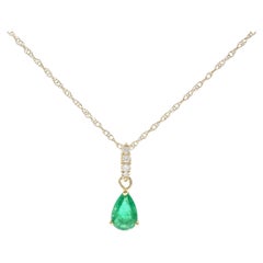 0.33 Carat Pear Cut Emerald with Diamond Accents 10K Yellow Gold Pendant 0.33 Carat Pear Cut Emerald with Diamond Accents 10K Yellow Gold Pendant