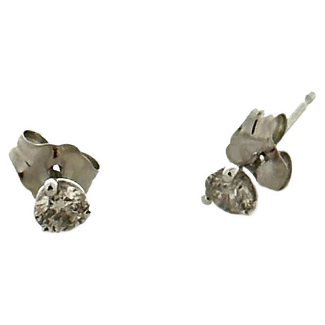 Stunning 14 Karat white gold handmade earrings featuring 2 round brilliant cut diamonds weighing 0.33 carat total I-J color and SI1 clarity. These gorgeous earrings are classic and timelessly elegant.