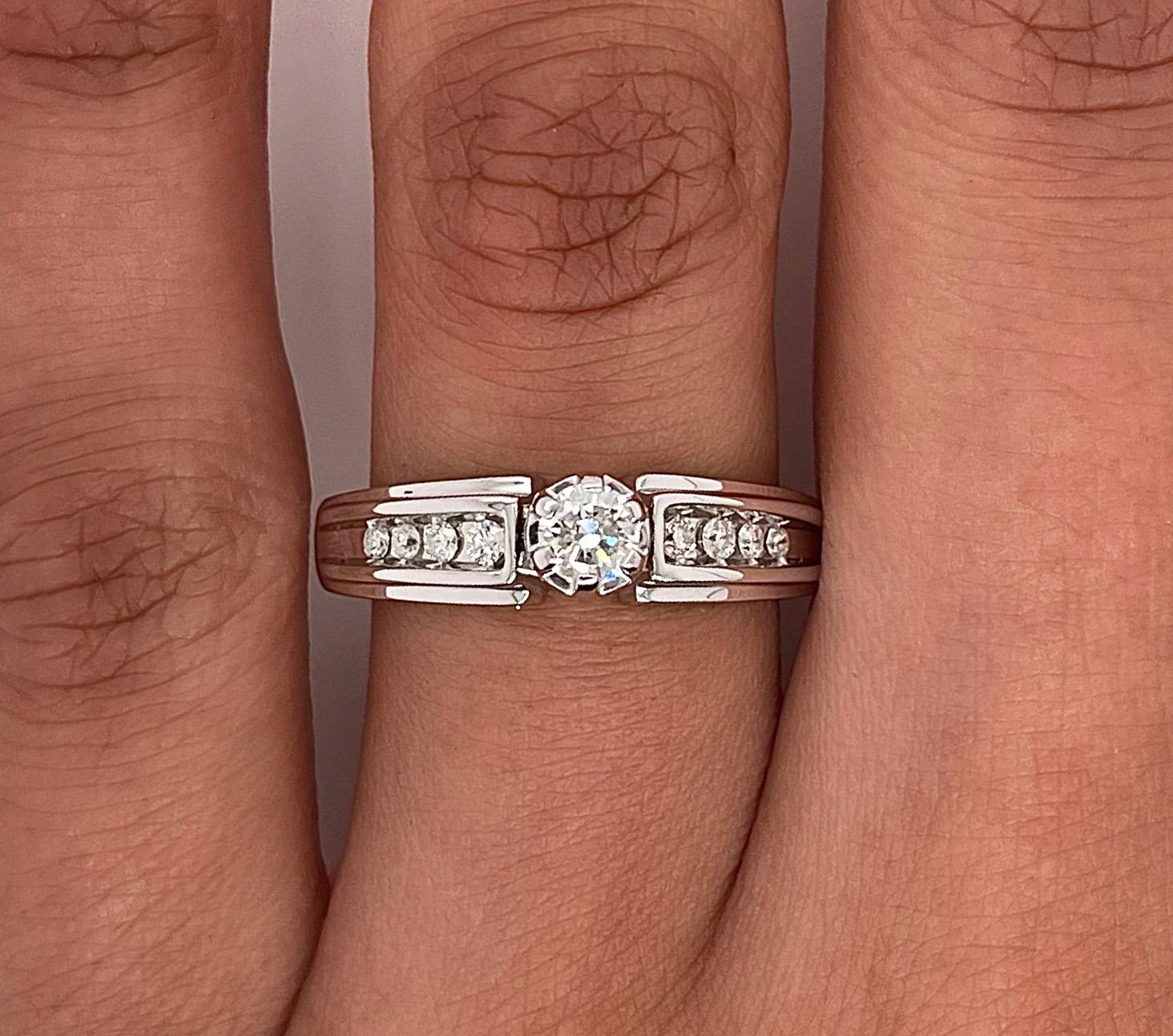 0.33 Total Carat Round Diamond Prong-Set Engagement Ring 

-14K White Gold
-0.21 Carat Round Diamond Center Stone
-H-I Color
-SI1/I1 Clarity
-0.12 Carat Round Side Stones
-H-I Color
-SI1/I1 Clarity 
-Size 7.0

Resize is available!

Made in New York