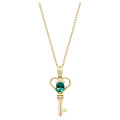 0.34 Carat Emerald Oval Cut and Diamond 14K Yellow Gold Classic Pendant