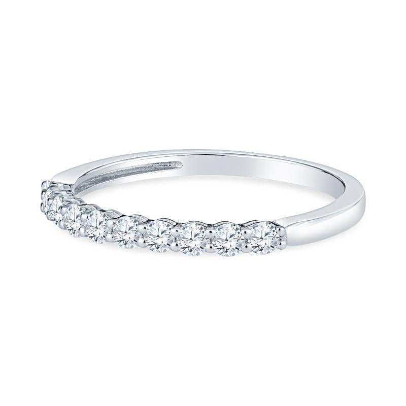 This band features 0.34 carat total weight in shared prong set round diamonds set in 18 karat white gold. This ring is currently a size 6.5 but can be resized upon request. 
Measurements: Width approximately 2.10mm