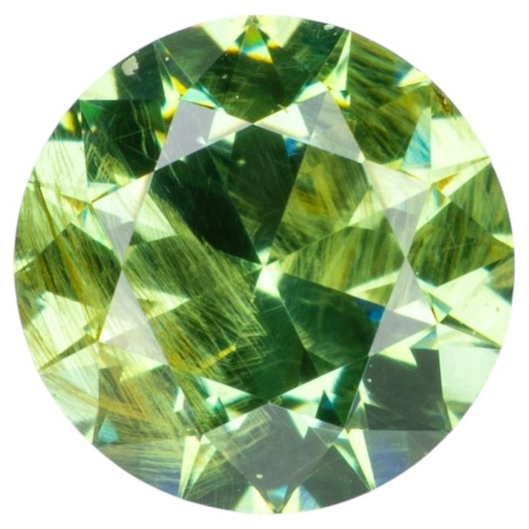 0.34 ct, Faceted Russian demantoid garnet with bissolite inclusions For Sale