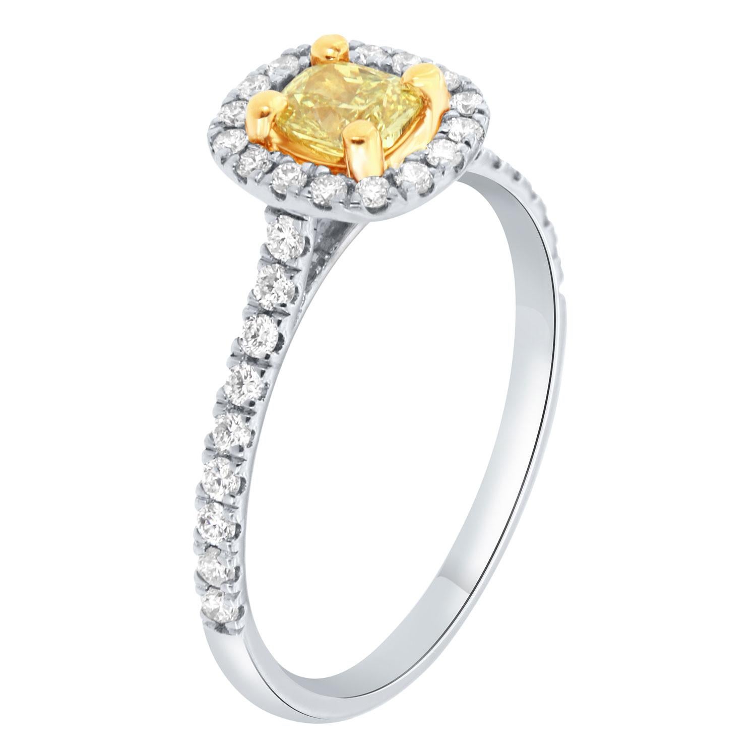 This 18K White and Yellow gold ring features a 0.35 - Carat Square Cushion Natural Yellow Diamond encircled by a halo of brilliant round diamonds on a one-row 1.6 mm wide band. The diamonds are Micro-Prong set on 50% of the band. The diamond's