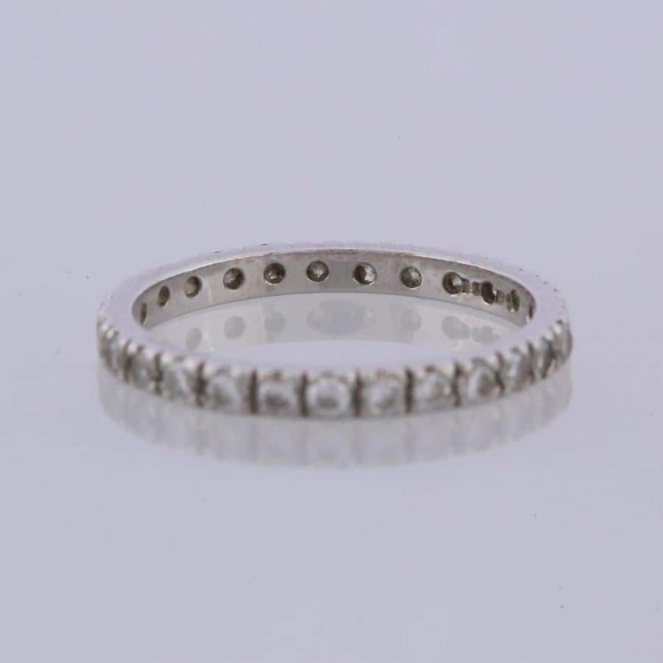 This is a platinum diamond full eternity ring. The ring plays host to 26 round brilliant cut diamonds that stretch across the whole band.

Condition: Used (Excellent)
Weight: 1.4 grams
Size: H
Band Width: 1.8mm
Total Diamond Carat Weight: Approx.