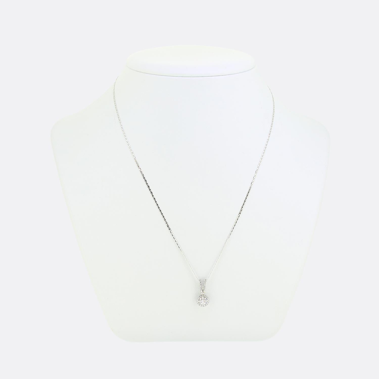 This is an 18ct white gold round brilliant cut diamond halo pendant attached to an 18ct white gold thin anchor chain.

Condition: Used (Very Good)
Total Weight: 3.0 grams
Total Diamond Carat Weight: 0.50 carat
Central Diamond Details: Weight: 0.35
