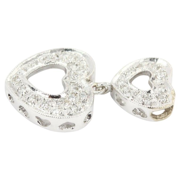 Show how much you love her by giving this stunning diamond heart pendant necklace. This piece shines elegantly in the light, drapes beautifully on the neck, and will look stunning from season to season! Simply elegant, two heart-shaped pendant