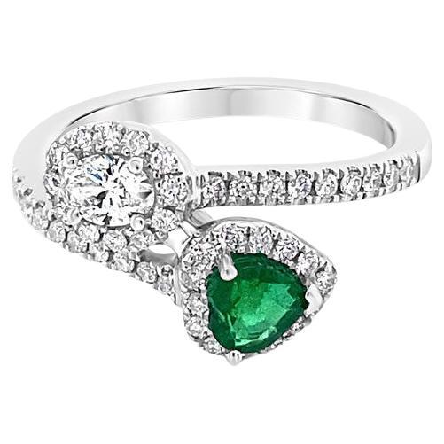 0.35 Carat Heart Shaped Emerald & 0.19 Carat Oval Cut Diamond Wrap Around Ring For Sale