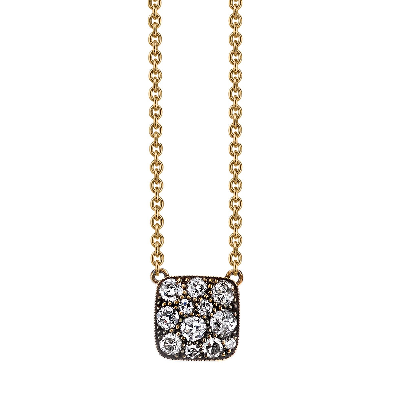 Approximately 0.35ctw varying old cut and round brilliant cut diamonds in a handcrafted 18K yellow gold pendant. Available in an oxidized or polished finish, please specify when ordering. Necklace measures 18