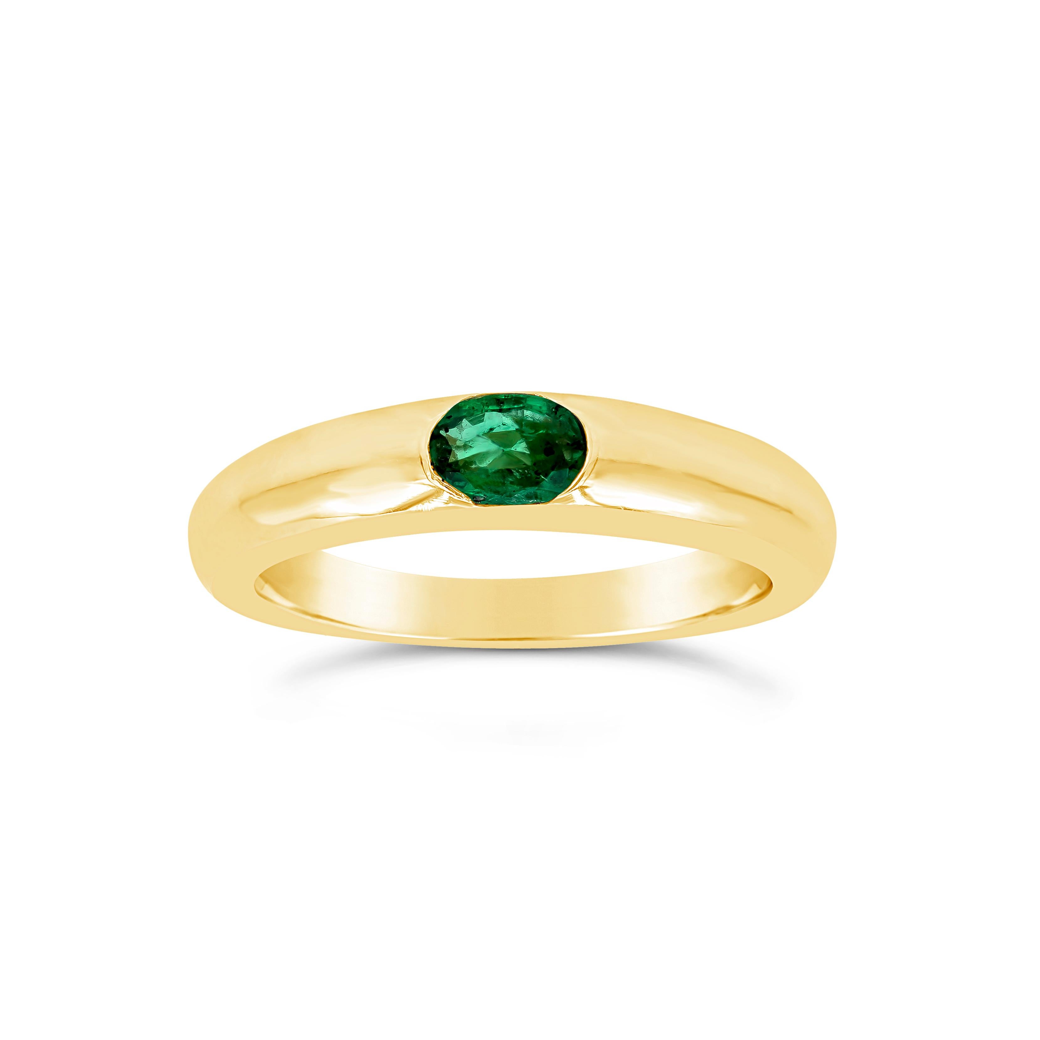 A simple and chic wedding band showcasing an oval cut color-rich green emerald, flush set in 14k yellow gold weighing 0.35 carats total. A simple ring perfect for both male and female. Size 6.5 US resizable upon request.

Style available in