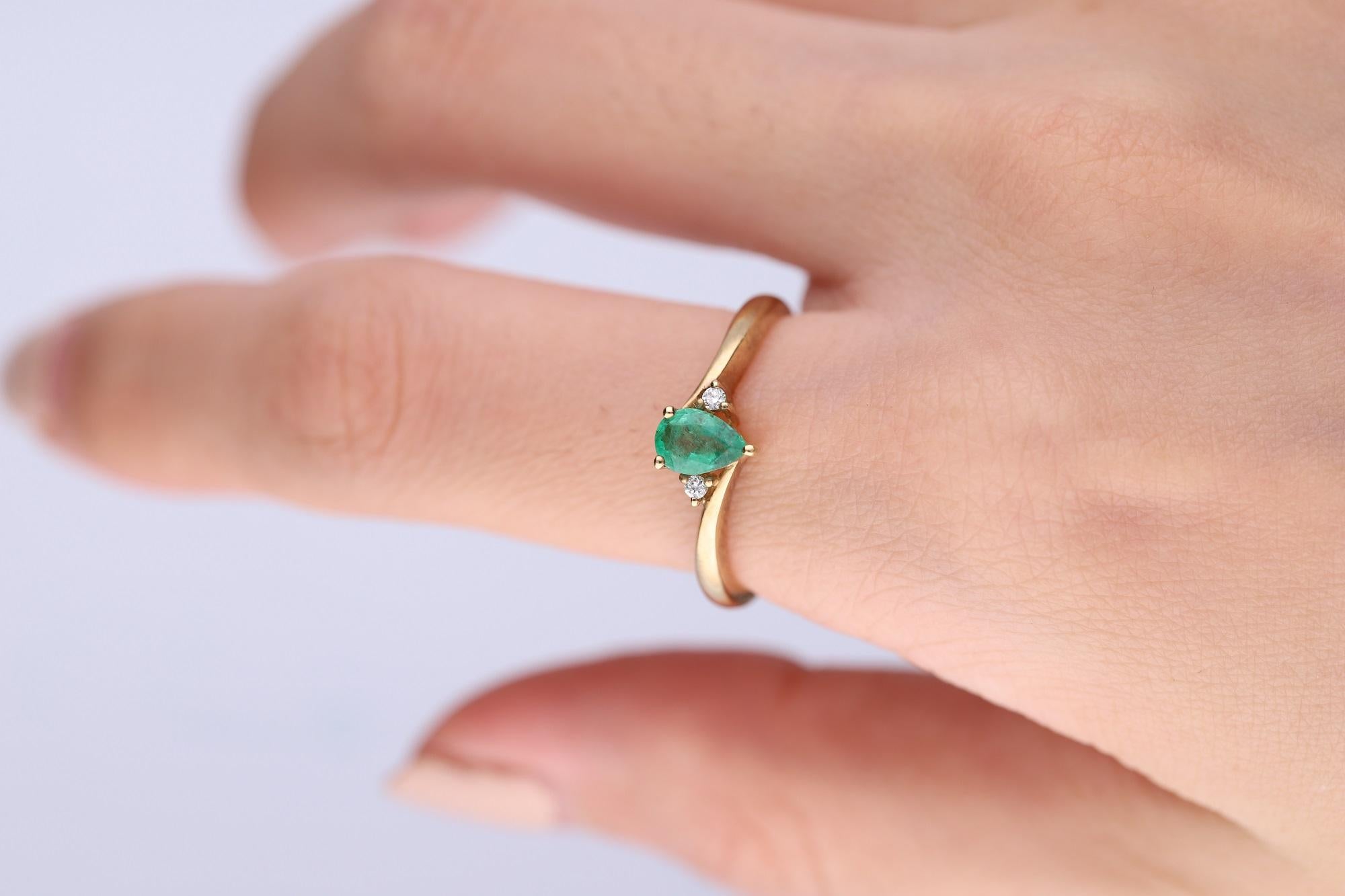 Stunning, timeless and classy eternity Unique Ring. Decorate yourself in luxury with this Gin & Grace Ring. The 14k Yellow Gold jewelry boasts Pear-Cut Prong Setting Natural Emerald (1 pcs) 0.35 Carat, along with Natural Round cut white Diamond (2