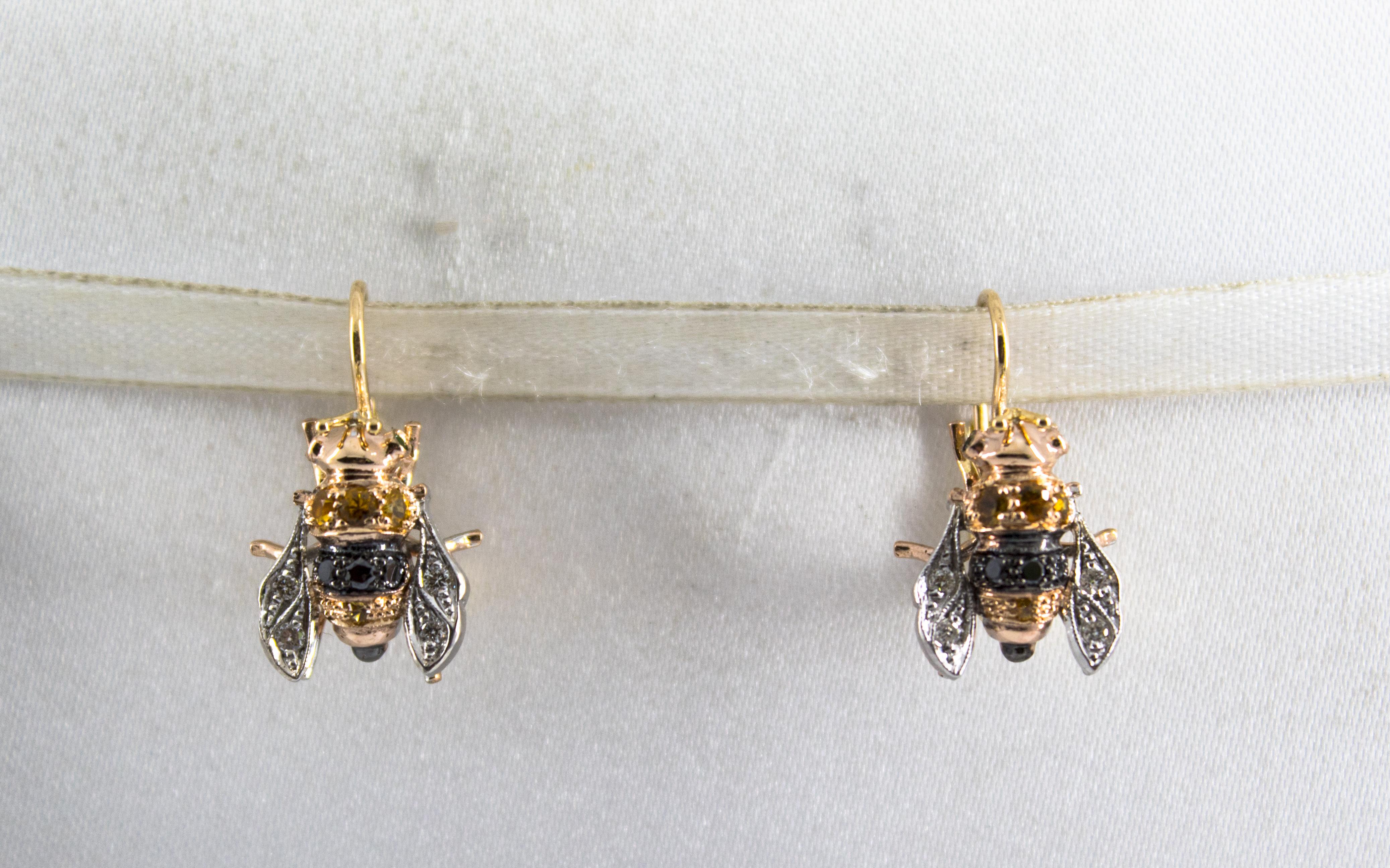 These Earrings are made of 9K Yellow Gold and Sterling Silver.
These Earrings have 0.16 Carats of White Diamonds.
These Earrings have 0.14 Carats of Black Diamonds.
These Earrings have 0.35 Carats of Yellow Sapphires.
All our Earrings have pins for