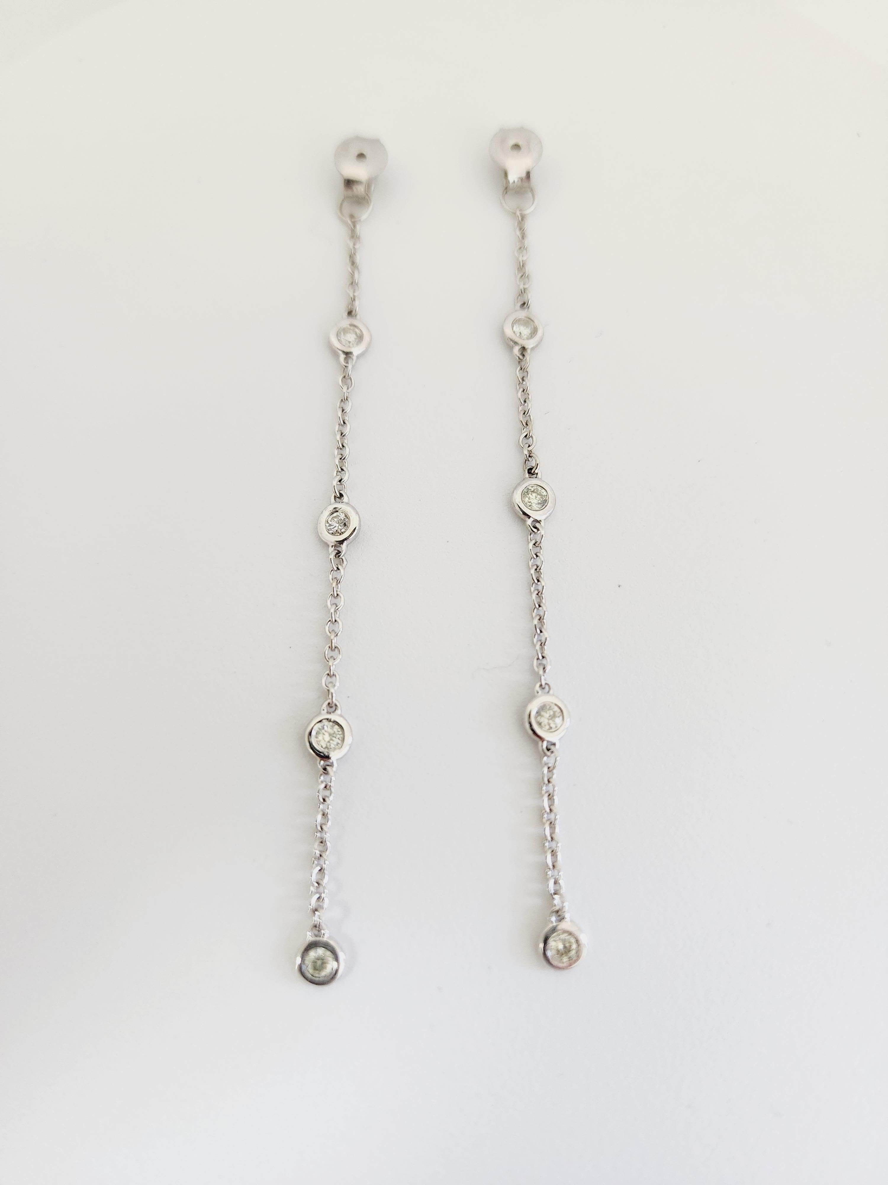 8 Stations Diamond by the yard Studs Jacket set in 14K White gold. The total weight is 0.35 total carats weight. Beautiful shiny stones. The total drop length is 2.50 inch. 4 stations each side, 8 stations total. Easy push back setting. This is use