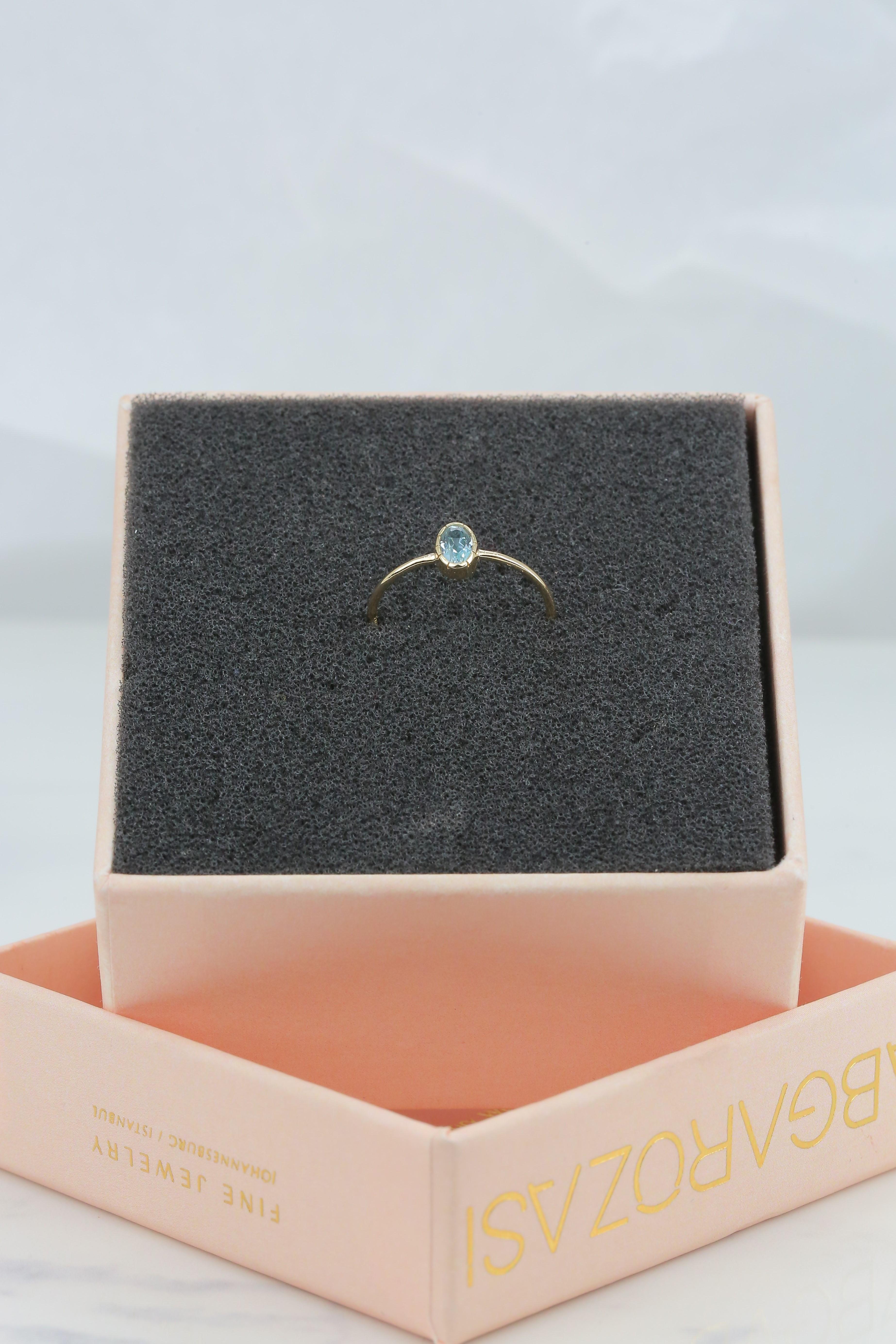 For Sale:  0.35 Ct Oval Cut Sky Topaz 14K Gold Birthstone Ring 5