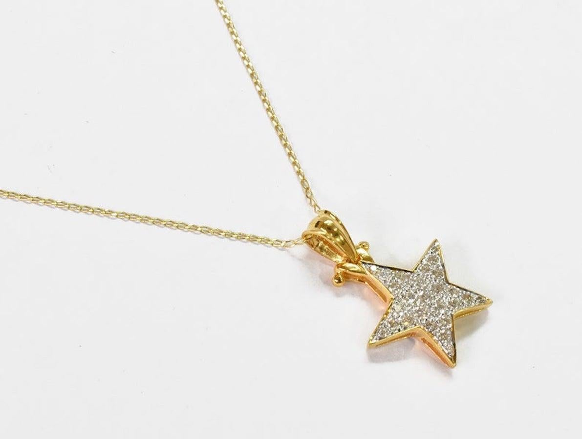 Lovely And delicate Star Charm Pendant Necklace In 18k Solid Gold featured with 0.35ct White Round Cut Diamond G color And Si Clarity. Fine Handmade and diamond are Handsets by master setter of Oshi Jewels.

