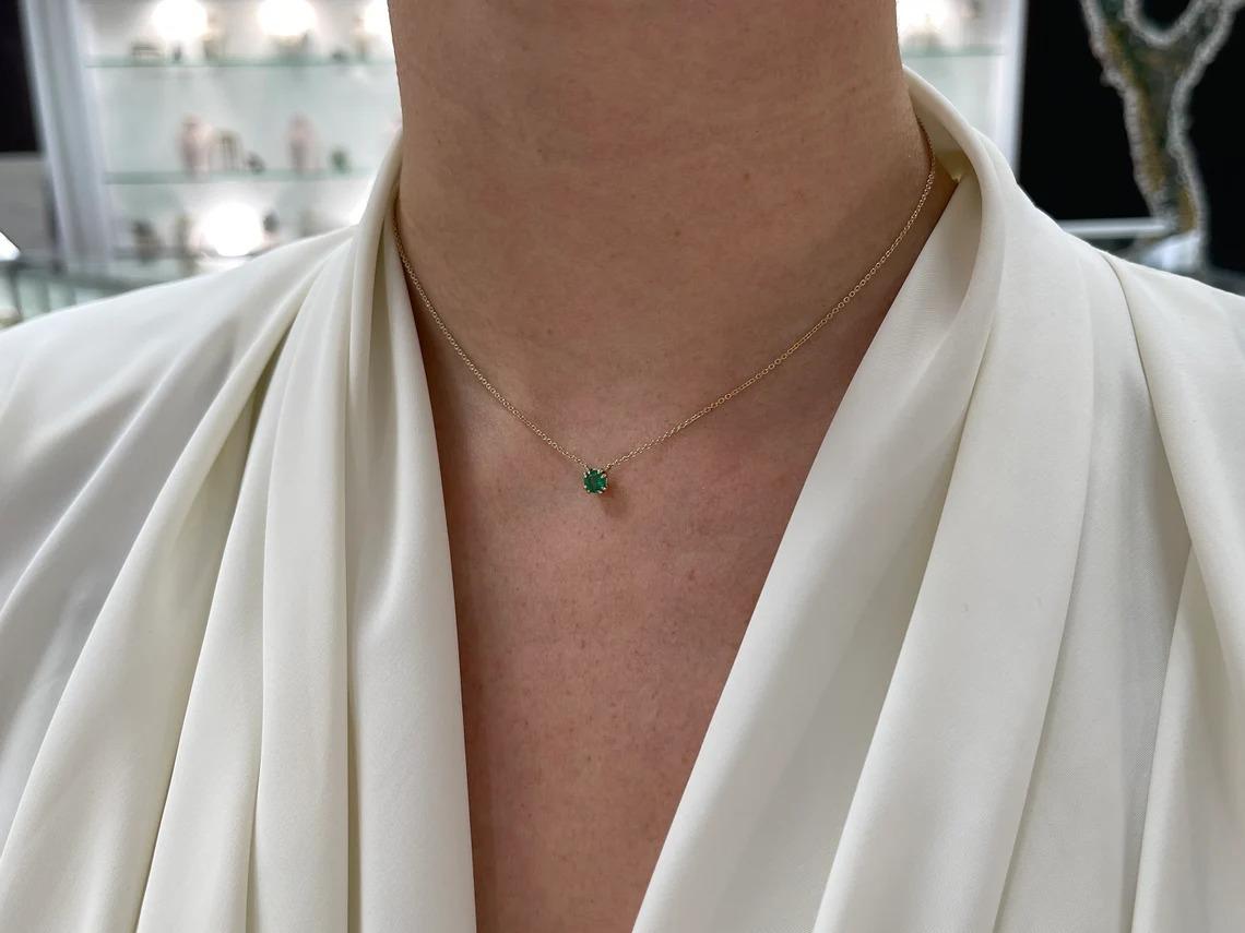 The perfect gift for you, or, someone you love very much. You can't go wrong with such a stunning, and dainty round-cut solitaire necklace. It carries a magical natural round cut emerald of high quality, as it has remarkable characteristics such as