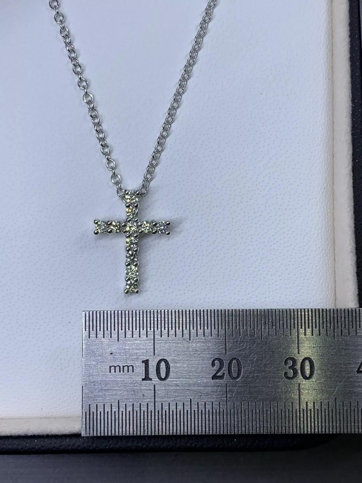 0.35ct Diamond cross pendant necklace eternity in 18k white gold chain.

Chunky large diamonds cross catholic pendant necklace in 18ct white gold solitaire pendant.

Diamonds fine quality F colour VS1 clarify.

Hallmarked.

Chain length 18