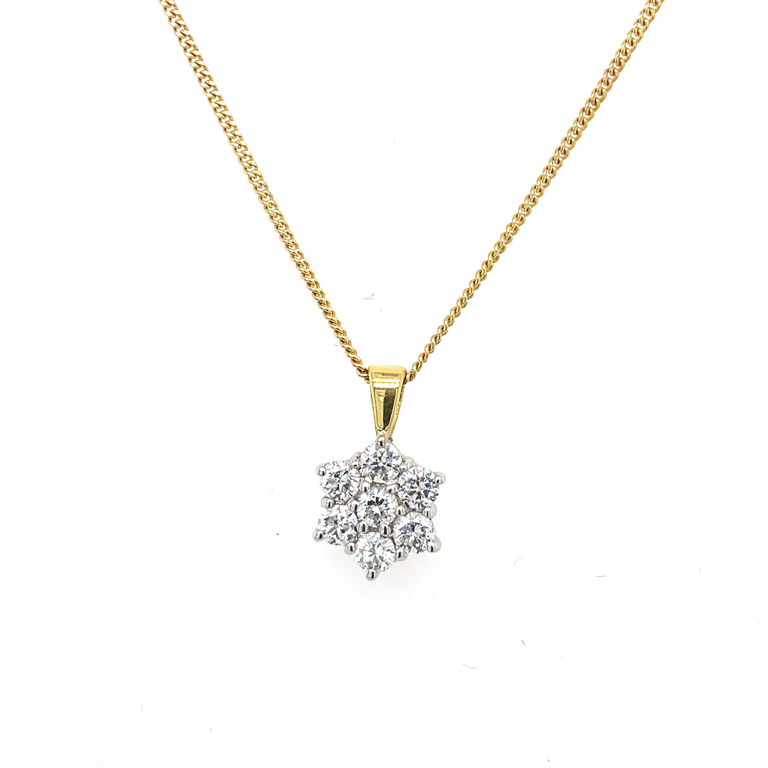 18ct Yellow Gold Diamond Cluster Pendant Set With 7 Diamonds Total Weight 0.35ct

Additional Information:
Total Diamond Weight: 0.35ct 
Diamond Colour: G/H
Diamond Clarity: Si
Total Weight: 3.2g
Pendant Diameter: 8.3mm
Chain Length: 16''
SMS2698