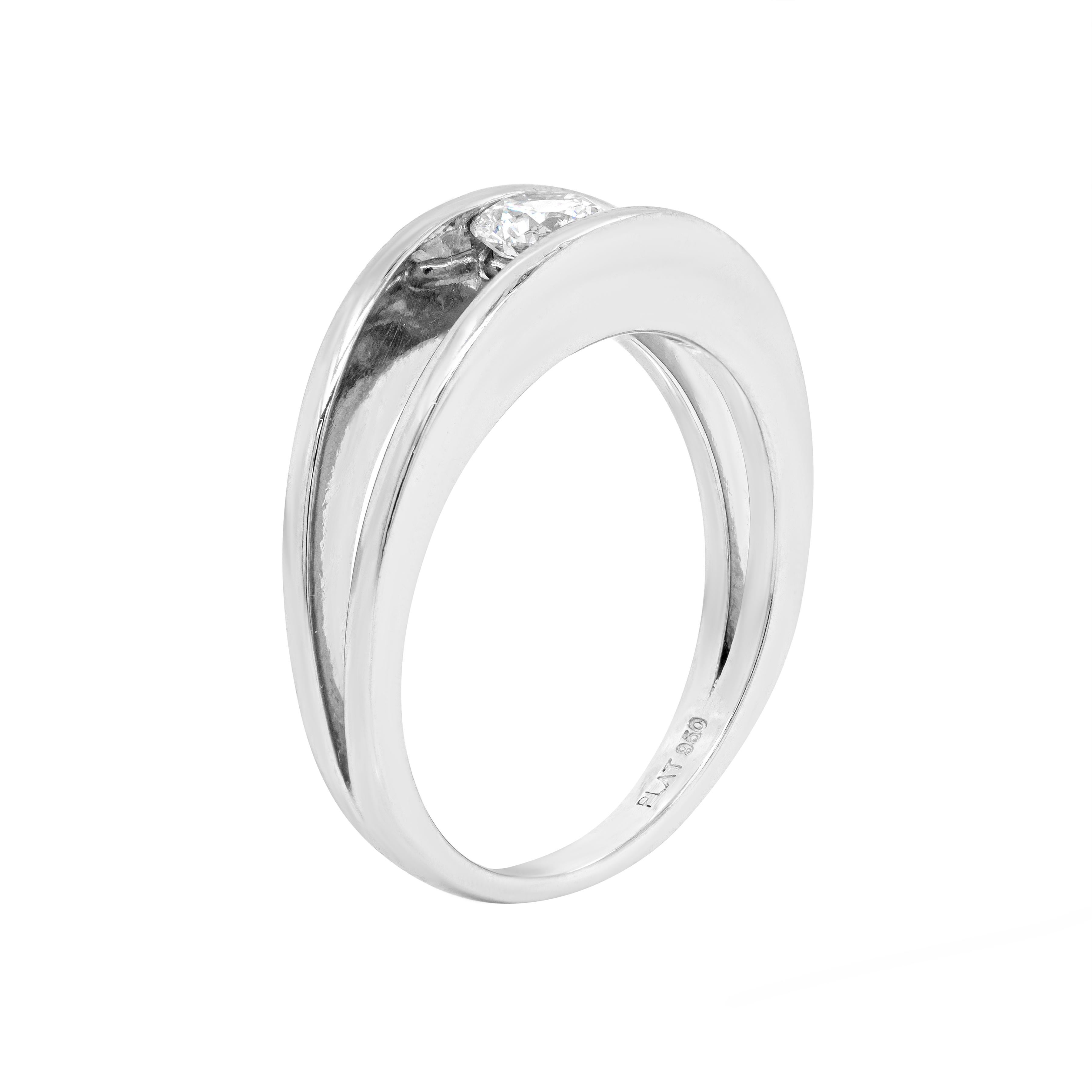 Minimalist, yet exquisitely designed, this platinum engagement ring features a beautiful 0.35ct round brilliant cut diamond, certified F in colour and SI2 in clarity, tension set into a split platinum band. Stamped SHIMANSKY, PLAT 950. UK finger