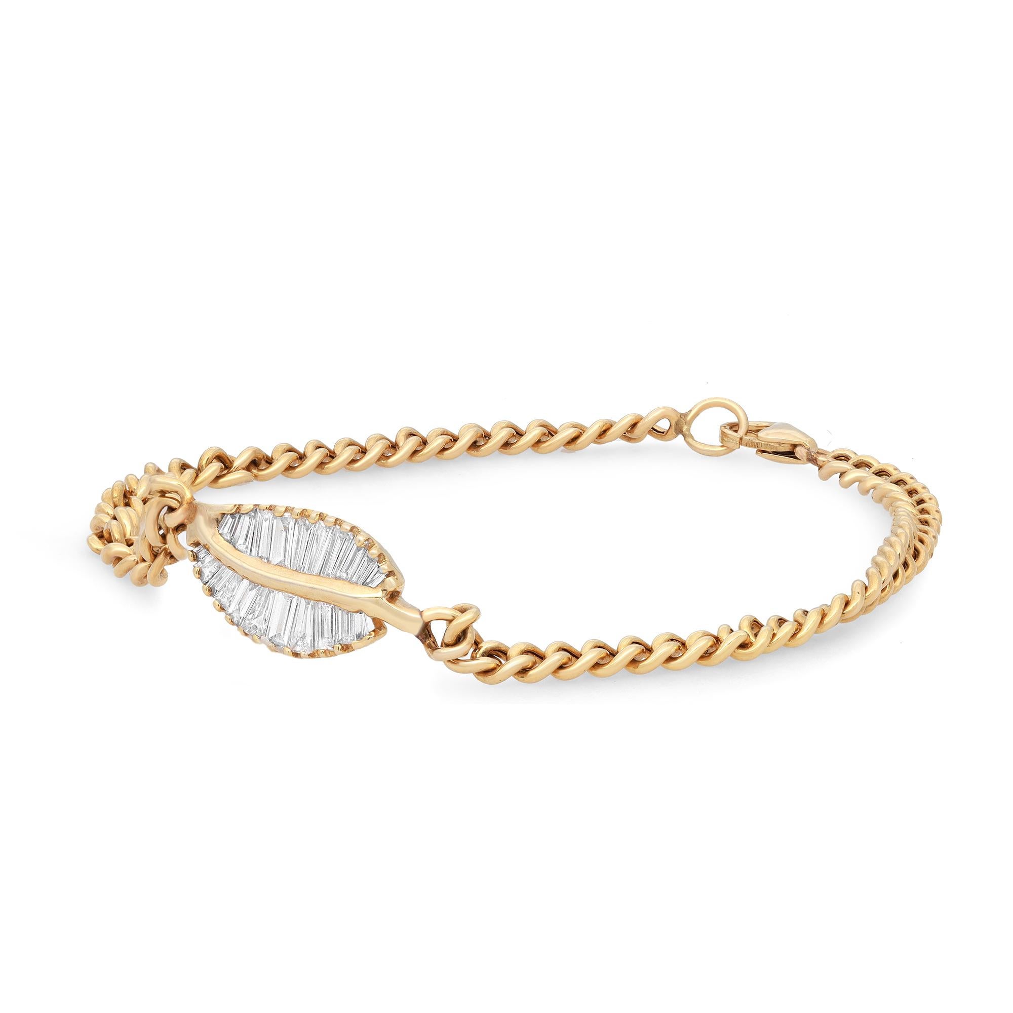 Embrace this classic Cuban link chain bracelet for the perfect everyday look. This sleek elegant bracelet features channel set baguette cut diamonds set in a leaf charm in the center. Crafted in high polish 14k yellow gold. Total diamond weight: